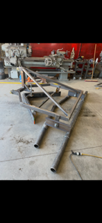 Welded triangular trailer components in fabrication shop
